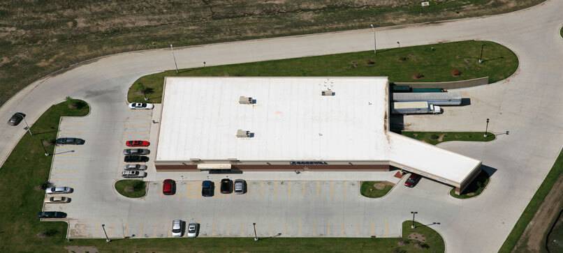 aerial view of commercial flat roof with overhang