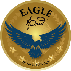 Golden circular medallion featuring a blue eagle with outstretched wings. The words "EAGLE Award" are above the eagle, and "Duro-Last® 2023" is below. Five golden stars circle the edges.